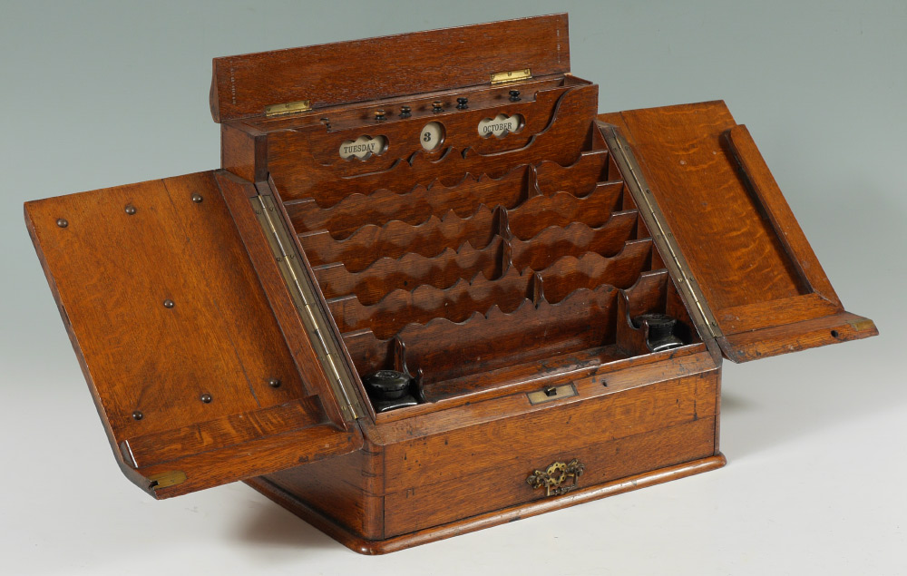 Appraisal: VICTORIAN ENGLISH OAK TRAVEL DESK Lift top reveals knobs to