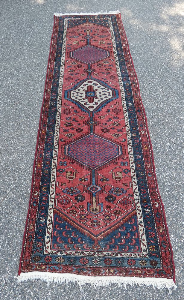 Appraisal: ANTIQUE CAUCASIAN RUNNER Antique Caucasian runner with red field and