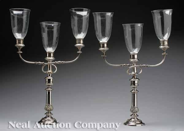 Appraisal: A Pair of Late Georgian Sheffield Three-Light Candelabra with hurricane