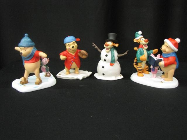 Appraisal: Four Pooh Porcelain Figurines with Accessories Including Chilly Willy Silly