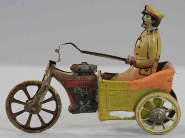 Appraisal: CITO CYCLE PENNY TOY Germany lithographed tin seated driver three