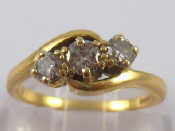 Appraisal: An carat gold three stone round brilliant cut diamond ring