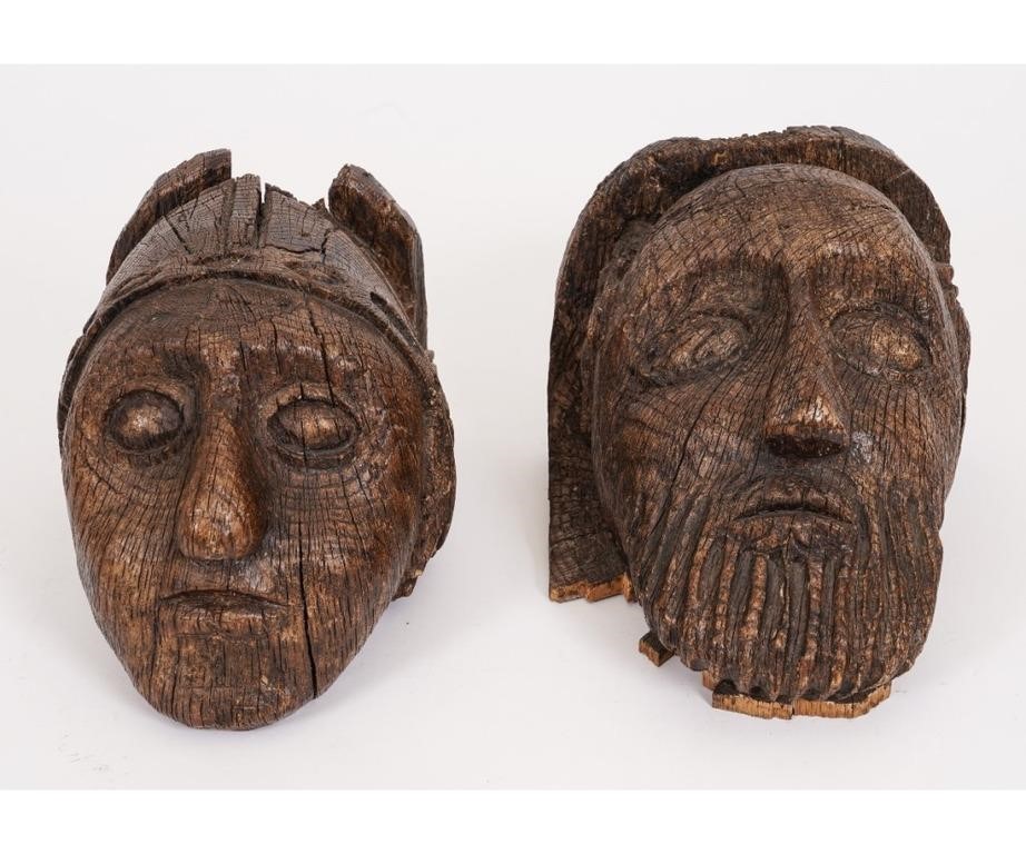 Appraisal: Two European medieval carved oak heads th c or before