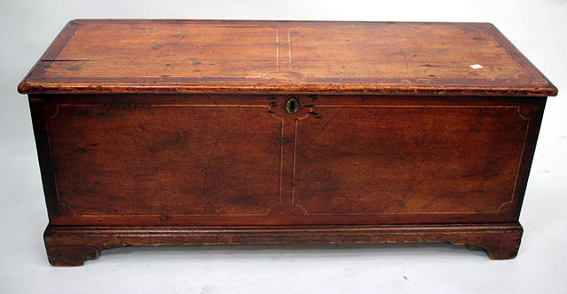 Appraisal: AN OLD STAINED PINE COFFER standing on bracket feet cm