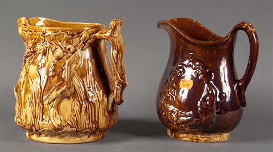 Appraisal: Two American Rockingham type molded relief glazed pottery pitchers second