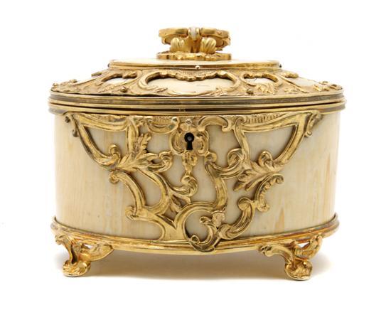 Appraisal: Gilt Metal Mounted Ivory Table Casket the oval lid centered