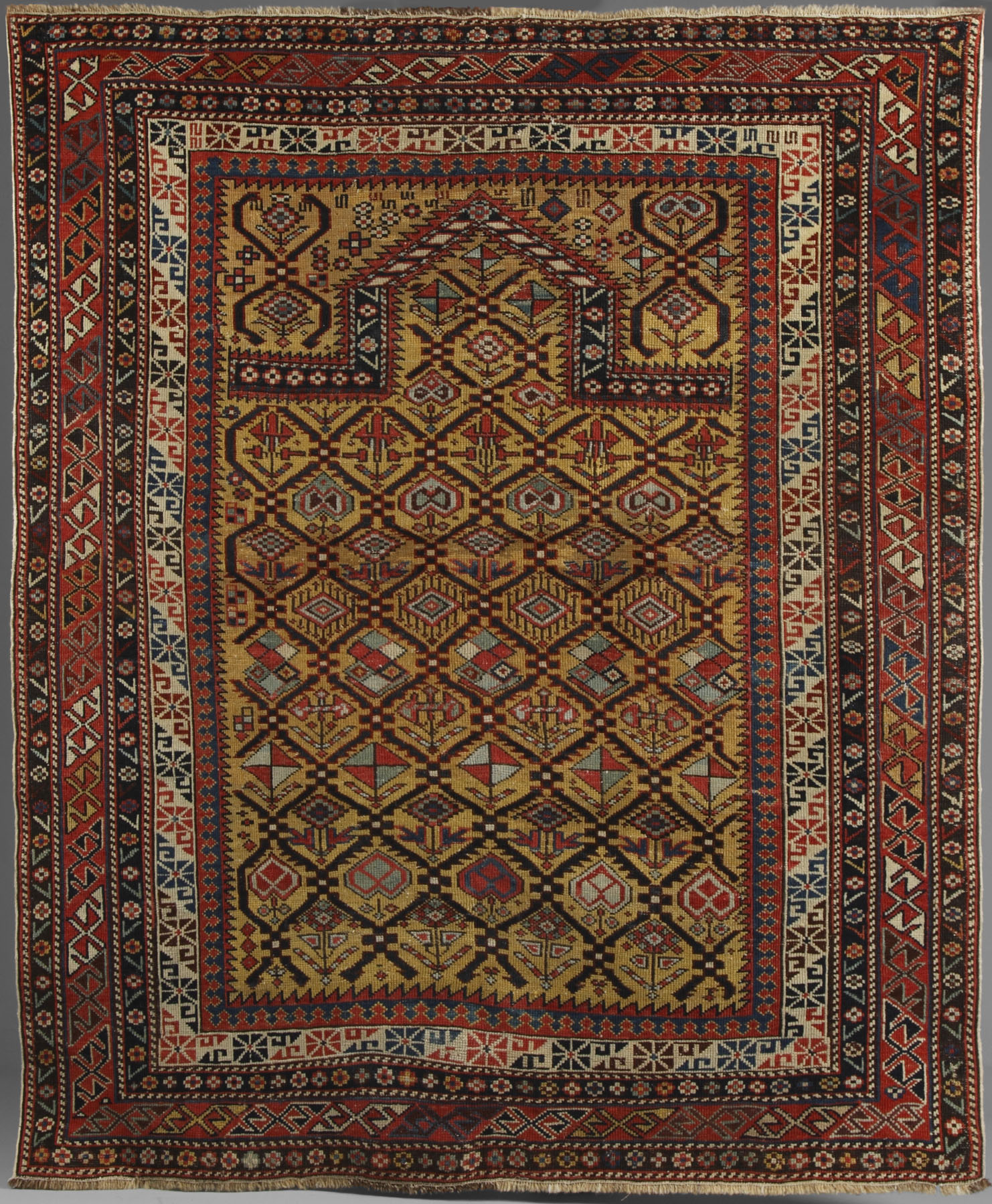 Appraisal: Daghestan prayer rug A gold ground antique Daghestan prayer rug