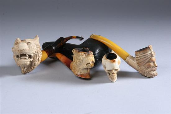 Appraisal: FOUR CARVED MEERSCHAUM PIPES Including a Sultan tiger skull and