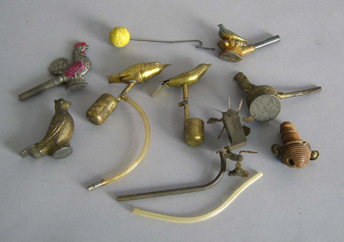 Appraisal: Four tin mechanical bird whistles together with lead examples and