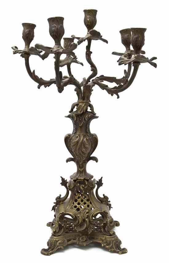 Appraisal: A Continental Bronze Six-Light Candelabrum having foliate decoration throughout raised