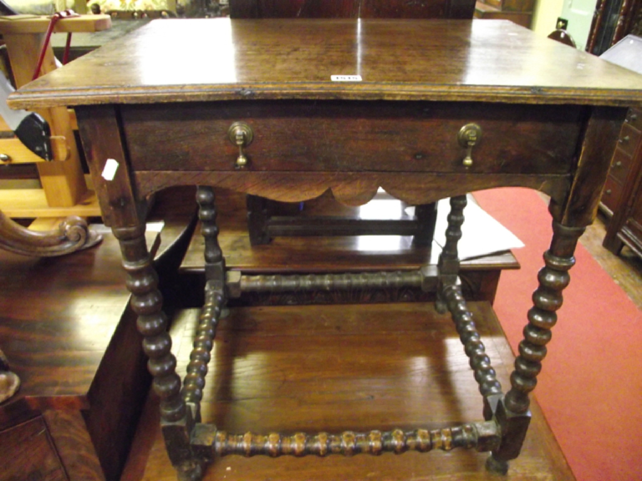 Appraisal: An old English oak side table incorporating a frieze drawer