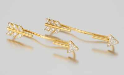 Appraisal: Two Diamond Set Arrow Ear Ornaments k yellow gold arrows