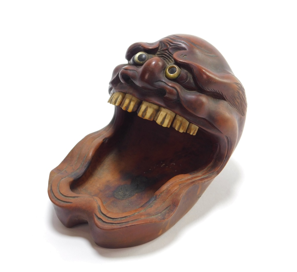 Appraisal: JAPANESE CARVED WOOD ONI ASHTRAY Japan th CenturyDepicts a the