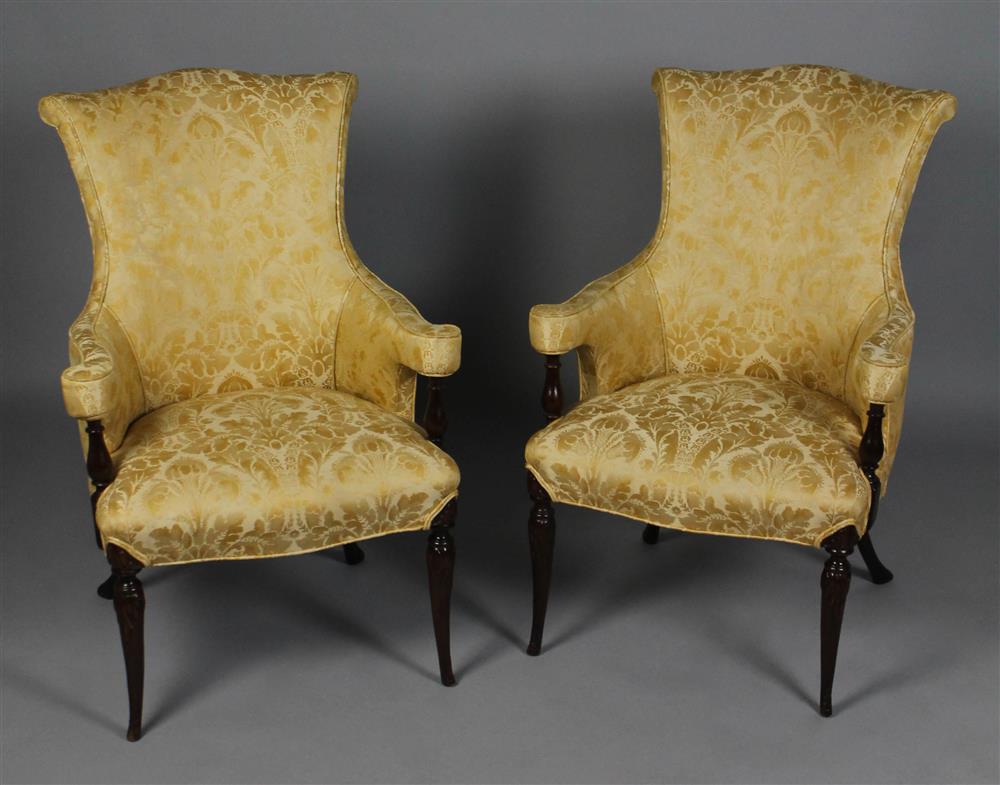 Appraisal: PAIR OF NEOCLASSICAL STYLE CARVED MAHOGANY UPHOLSTERED ARM CHAIRS each