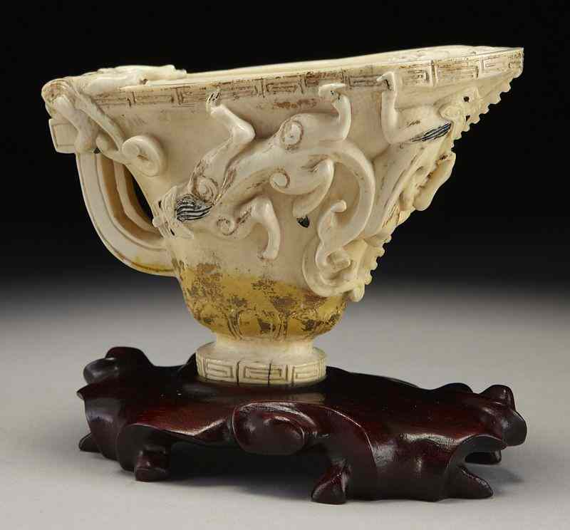 Appraisal: Chinese Qing carved ivory libation cup depicting International buyers should