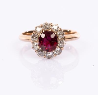 Appraisal: A ruby and diamond cluster ring the central ruby to