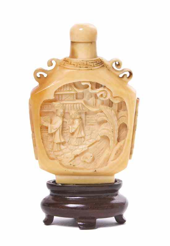 Appraisal: A Carved Hornbill Snuff Bottle of compressed flask form having