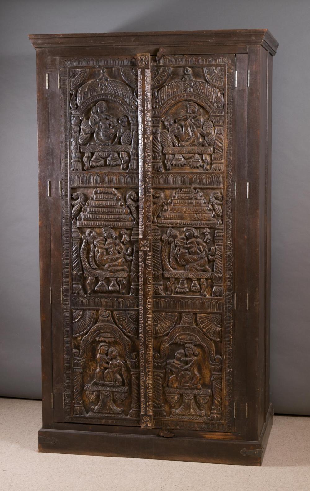 Appraisal: CARVED KAMA SUTRA DOUBLE-DOOR WARDROBE India th century featuring a