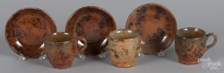 Appraisal: Three Pennsylvania redware cups and saucers attributed to Jacob Medinger