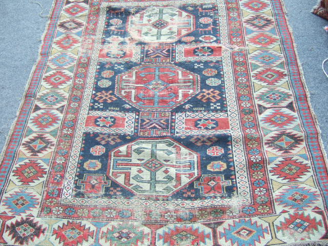 Appraisal: A Shirvan rug Caucasian the indigo field with two medallions