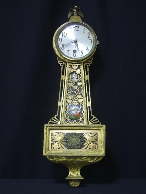 Appraisal: WATERBURY CO GILTWOOD BANJO CLOCK Of typical form carved with