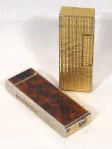 Appraisal: A gold plated Dunhill lighter together with one other