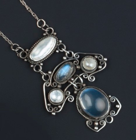 Appraisal: Arts CraftsMoonstone and blister pearl pendant circa - scrolled wirework