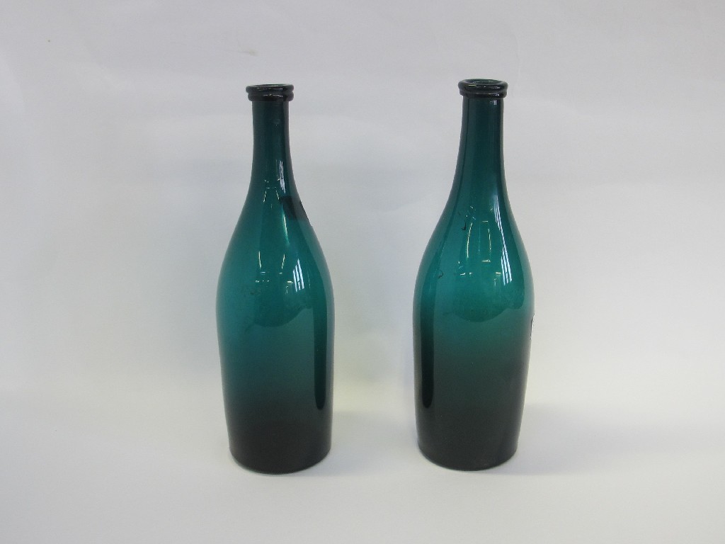 Appraisal: Pair of green glass wine bottles