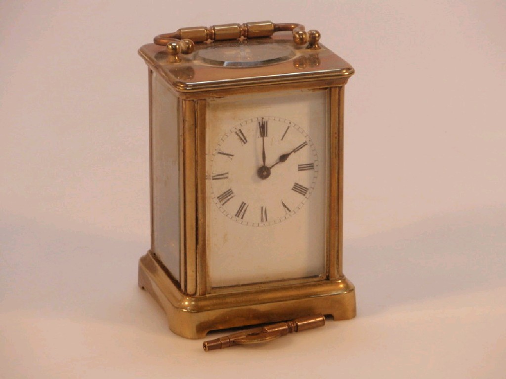 Appraisal: A gilt metal carriage clock with a timepiece lever movement