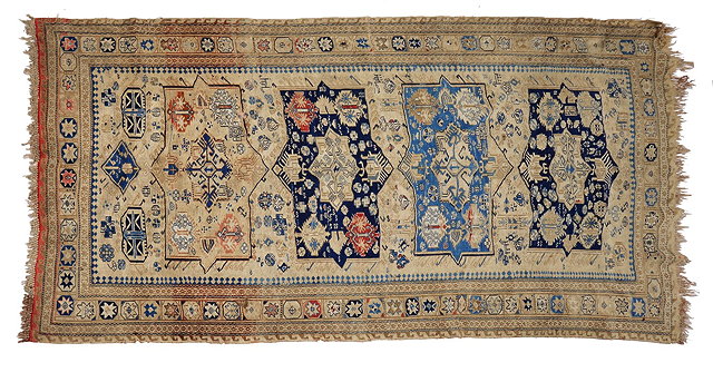 Appraisal: AN OLD SOUMAK SMALL CARPET decorated with four panels of