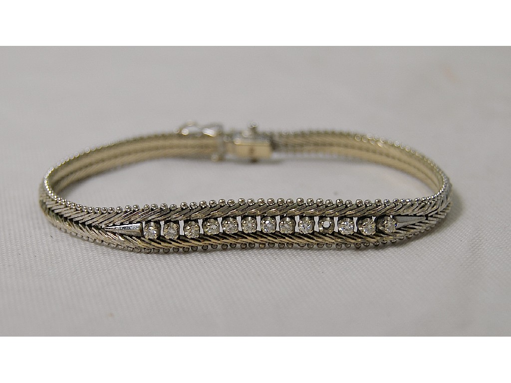 Appraisal: Yellow and white metal mesh bracelet stamped with diamond set