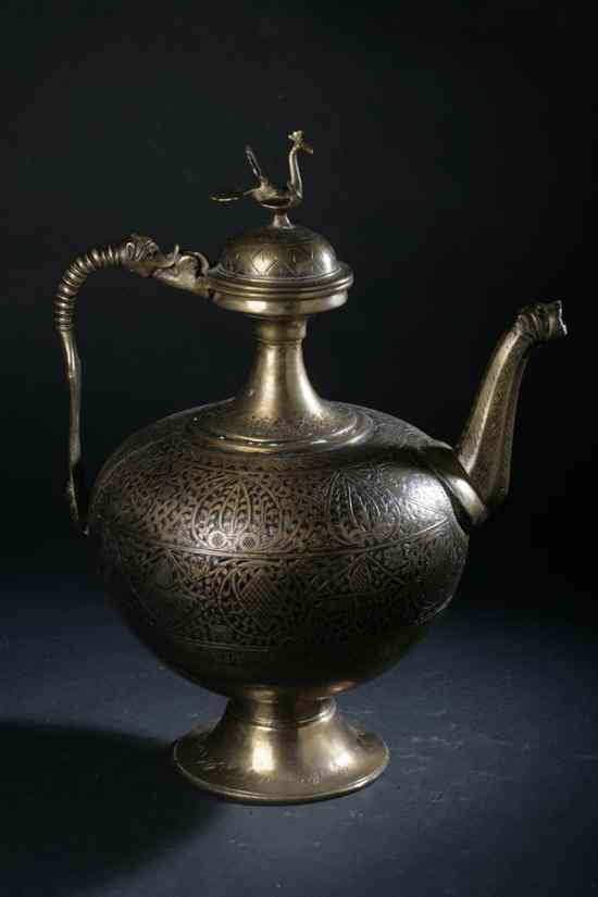 Appraisal: TURKISH BRASS EWER Chased with arabesque decoration bird finial -