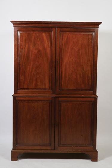 Appraisal: A GEORGE III MAHOGANY LINEN PRESS the moulded cornice above