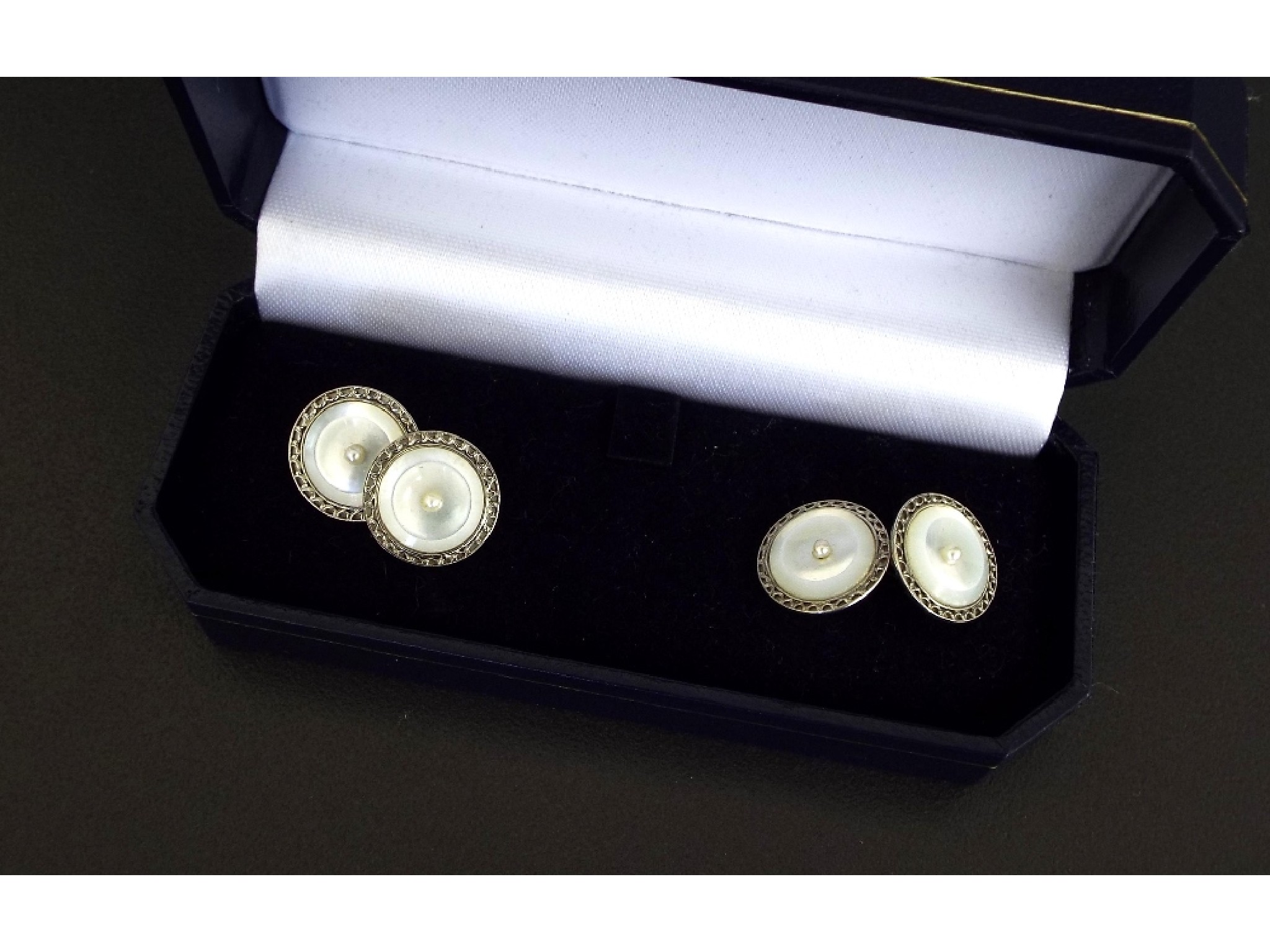 Appraisal: Pair of antique gold and mother of pearl cufflinks each