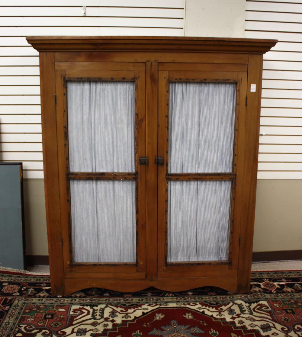 Appraisal: COUNTRY PINE CUPBOARD American late century the two full-length doors