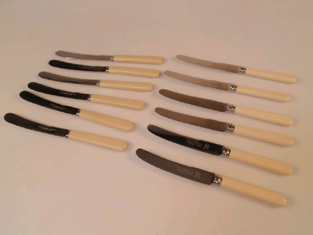 Appraisal: Two sets of six butter knives