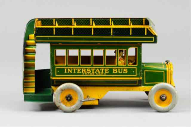 Appraisal: STRAUSS INTERSTATE BUS Lithographed tin green and yellow version upper