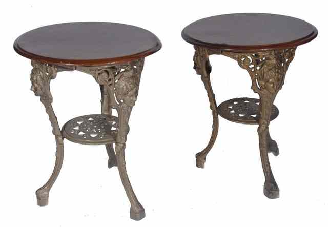 Appraisal: A PAIR OF VICTORIAN CAST IRON PUB TABLES with later