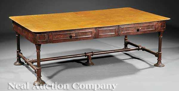 Appraisal: A Cast Iron Industrial Low Table riveted top four apron