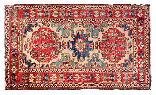 Appraisal: A CAUCASIAN KASAK STYLE EASTERN RUG with a polychrome geometric