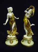 Appraisal: A pair of Naples figures each modelled with flowing robes