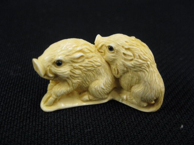 Appraisal: CArved Ivory Netsuke of Two Wild Boars onyx eyes signed