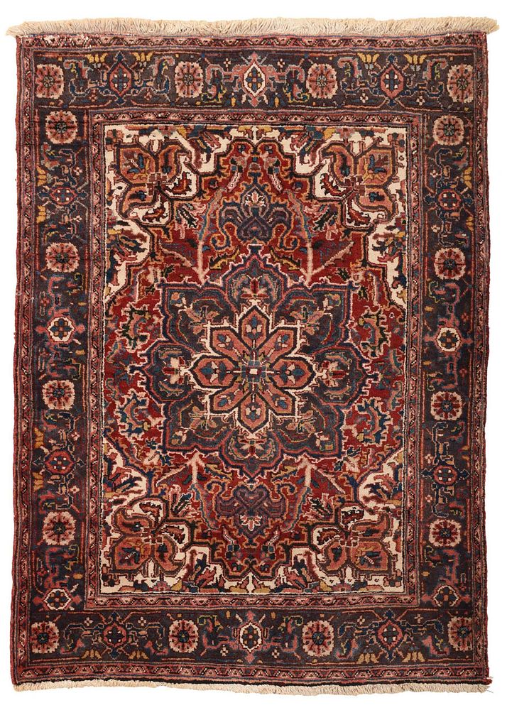 Appraisal: Heriz Rug th century floral central medallion red field with