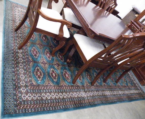 Appraisal: PAKISTANI BOKHARA CARPET hand knotted in an overall Turkoman gol