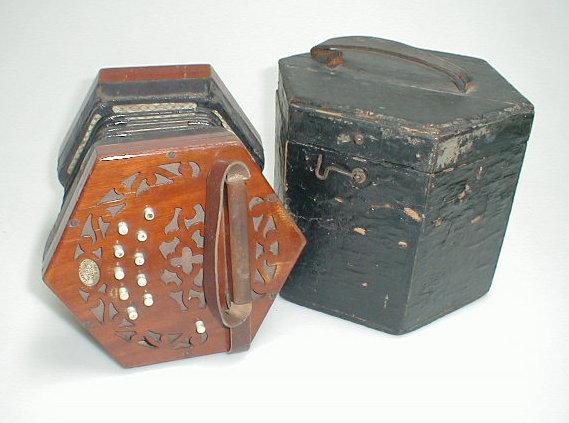 Appraisal: A Lachenal Co hexagonal concertina with mahogany fret cut ends