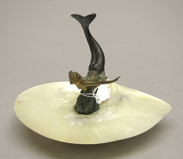 Appraisal: A cold painted bronze and shell figural vide poche first