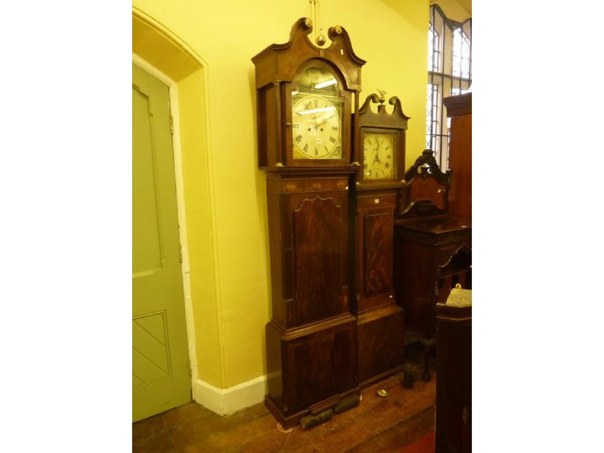 Appraisal: A Georgian mahogany longcase clock the trunk partially enclosed by