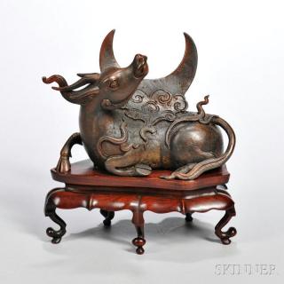 Appraisal: Cast Bronze Qilin-shape Holder China th century depicted seated with