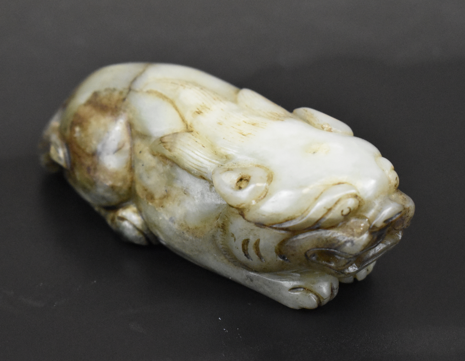 Appraisal: A Chinese jade carved beast figure dating from the Qing