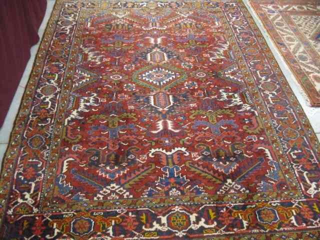 Appraisal: Heriz Persian Handmade Rug fine geometrics thick pile red field